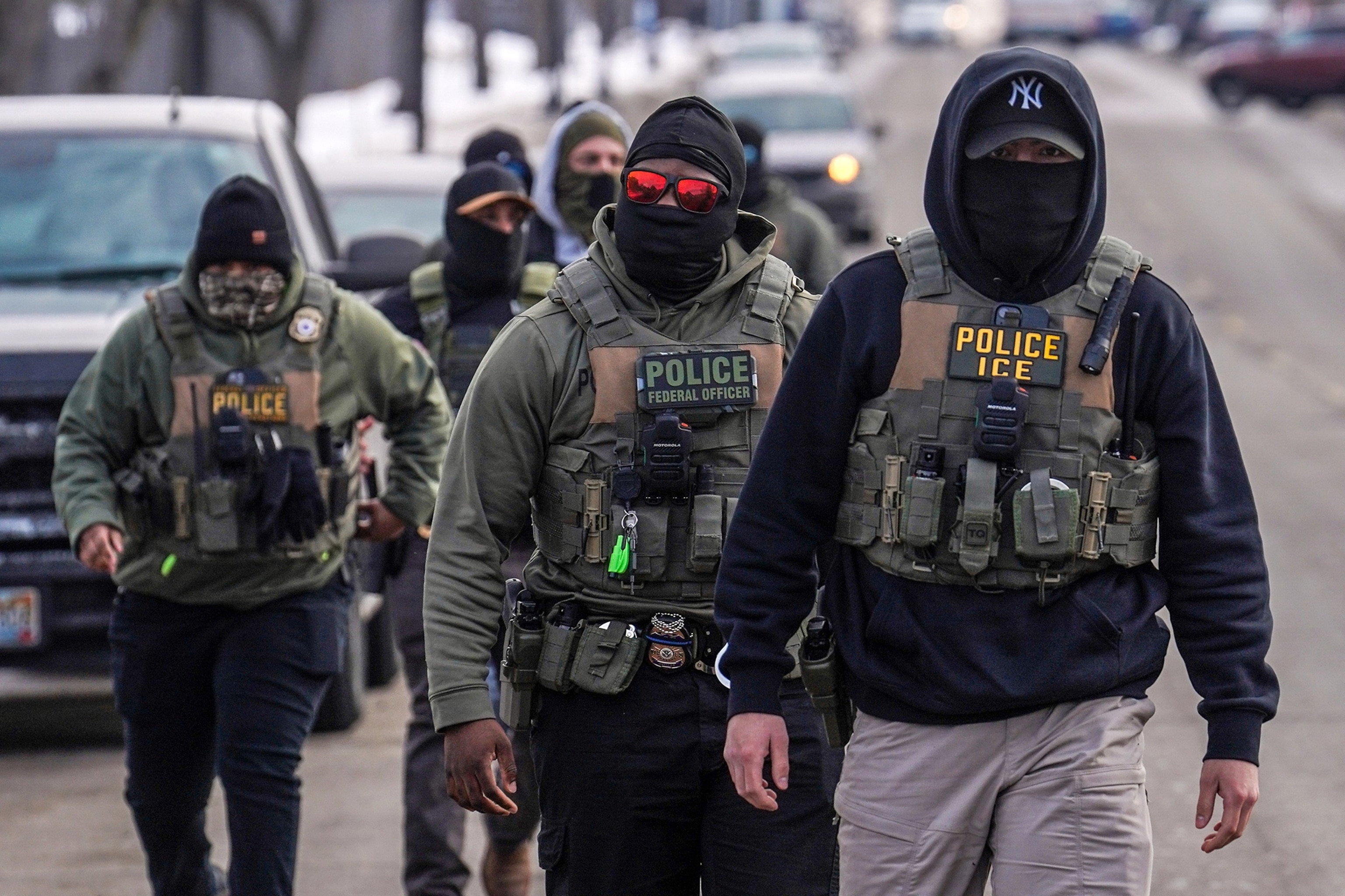 In this Feb. 5, 2026, file photo, federal agents walk down a street while conducting immigration enforcement operations in Minneapolis.Ryan Murphy/AP Photo, FILE