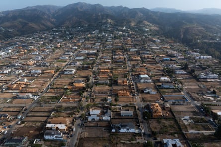 Aerial view of the Pacific Palisades community undergoing reconstruction after the Eaton fire on 17 July in Los Angeles.Photograph: Qian Weizhong/VCG/Getty Images