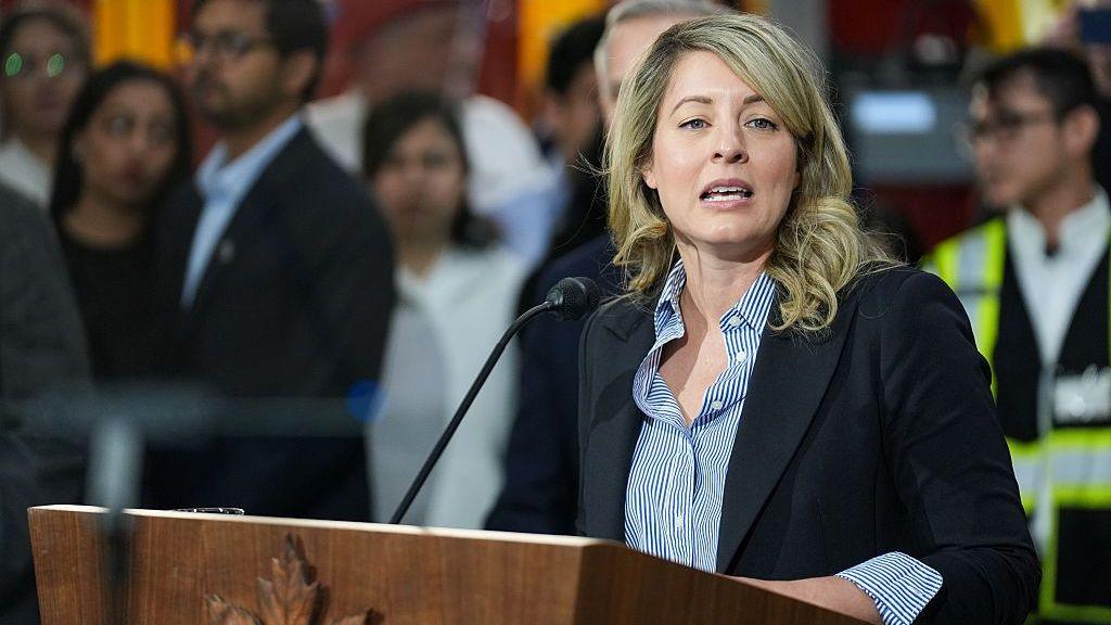 Image caption,Canada's Industry Minister Melanie Joly said her country is "very glad" the researchers are choosing to relocate to Canada