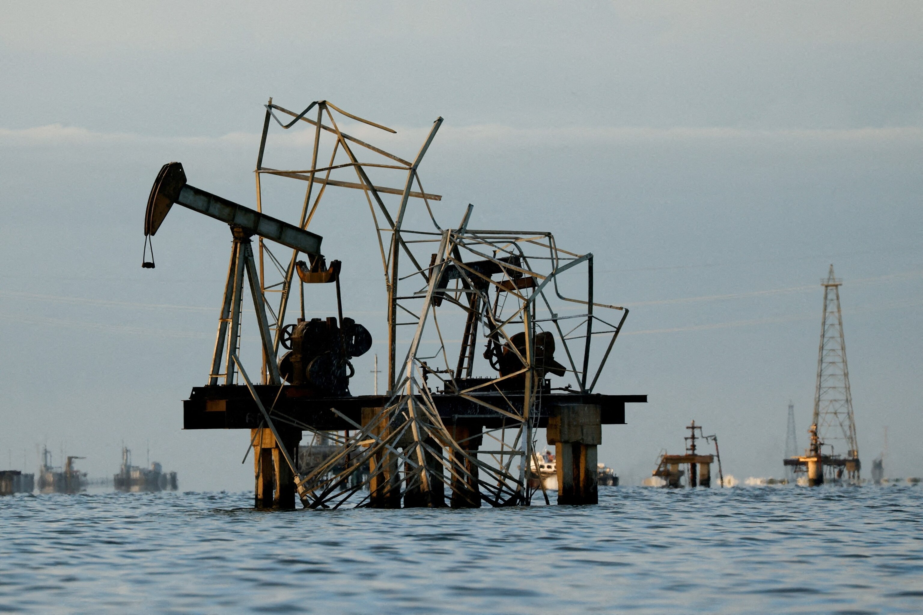 Abandoned pumpjacks damaged over time at a field of state oil company PDVSA on Lake Maracaibo, as residents around the oil-rich center of Maracaibo in Zulia state remain uncertain about new investments following recent legislative reforms allowing greater private participation in PDVSA and aimed at revitalizing the country's struggling oil sector, in Cabimas, Venezuela, January 27, 2026.Leonardo Fernandez Viloria/Reuters