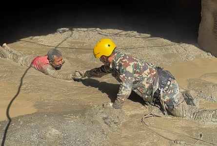A Nepali soldier rescues a survivor from a hydropower tunnel in Rasuwa district, Nepal.Photograph: Nepal Army Handout/EPA