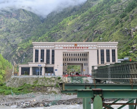 The Chinese immigration centre on the Tibet border. The green Friendship Bridge which crosses the river between Tibet and Nepal was swept away in the floods.Photograph: Armand Terruli/Guardian Community