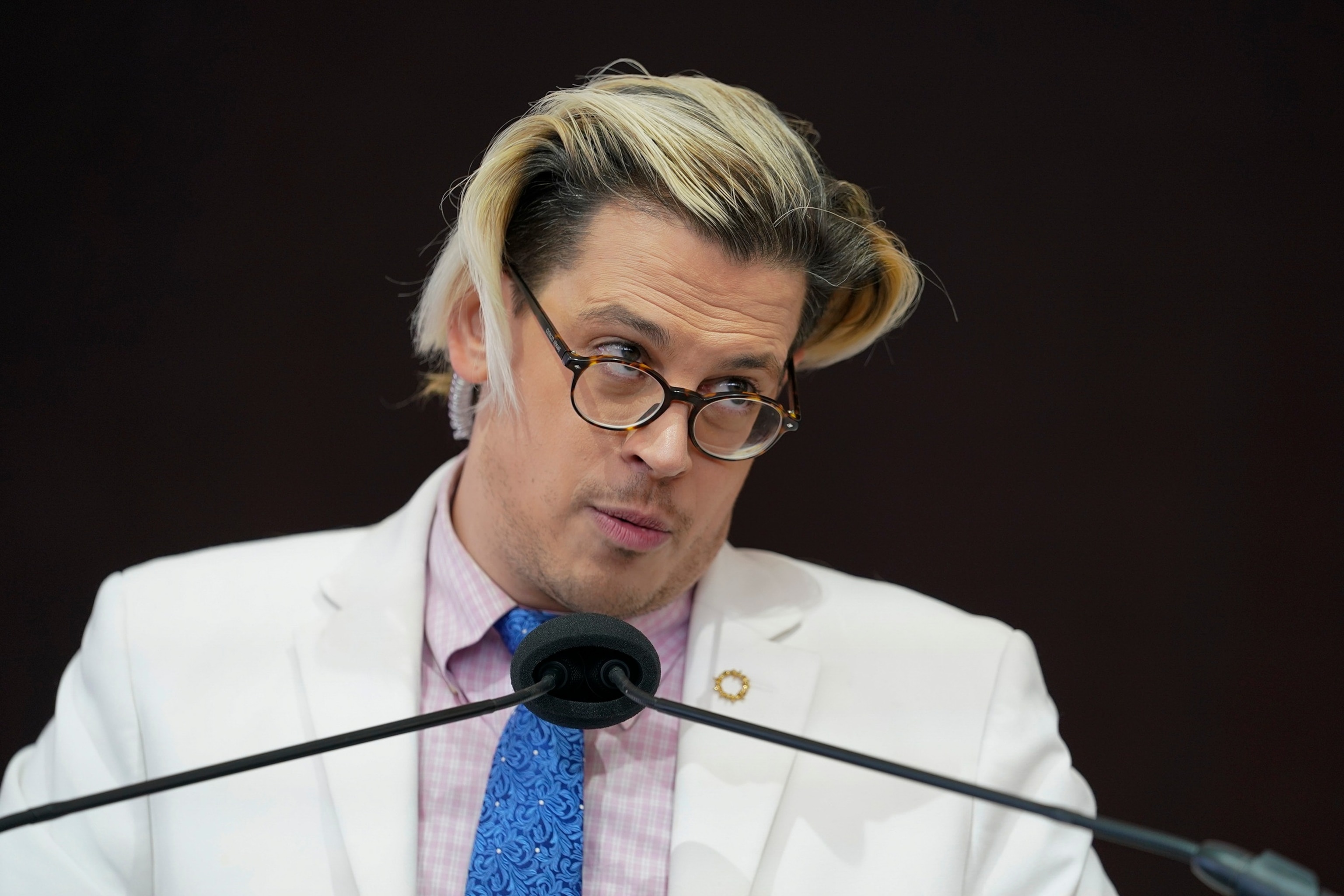 In this Nov. 16, 2021, file photo, activist Milo Yiannopoulos speaks during a rally in Baltimore.Julio Cortez/AP, FILE