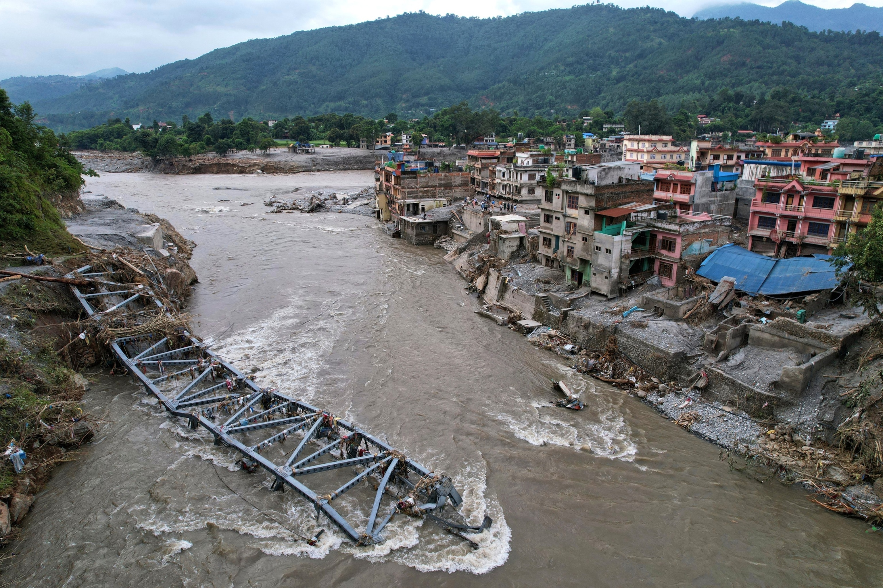 A drone view of a bridge damaged by flash flooding along the Tadi River in the Devighat area of Nuwakot district, Nepal, Aug. 29, 2026.Rajesh Kumar Singh/AP Photo