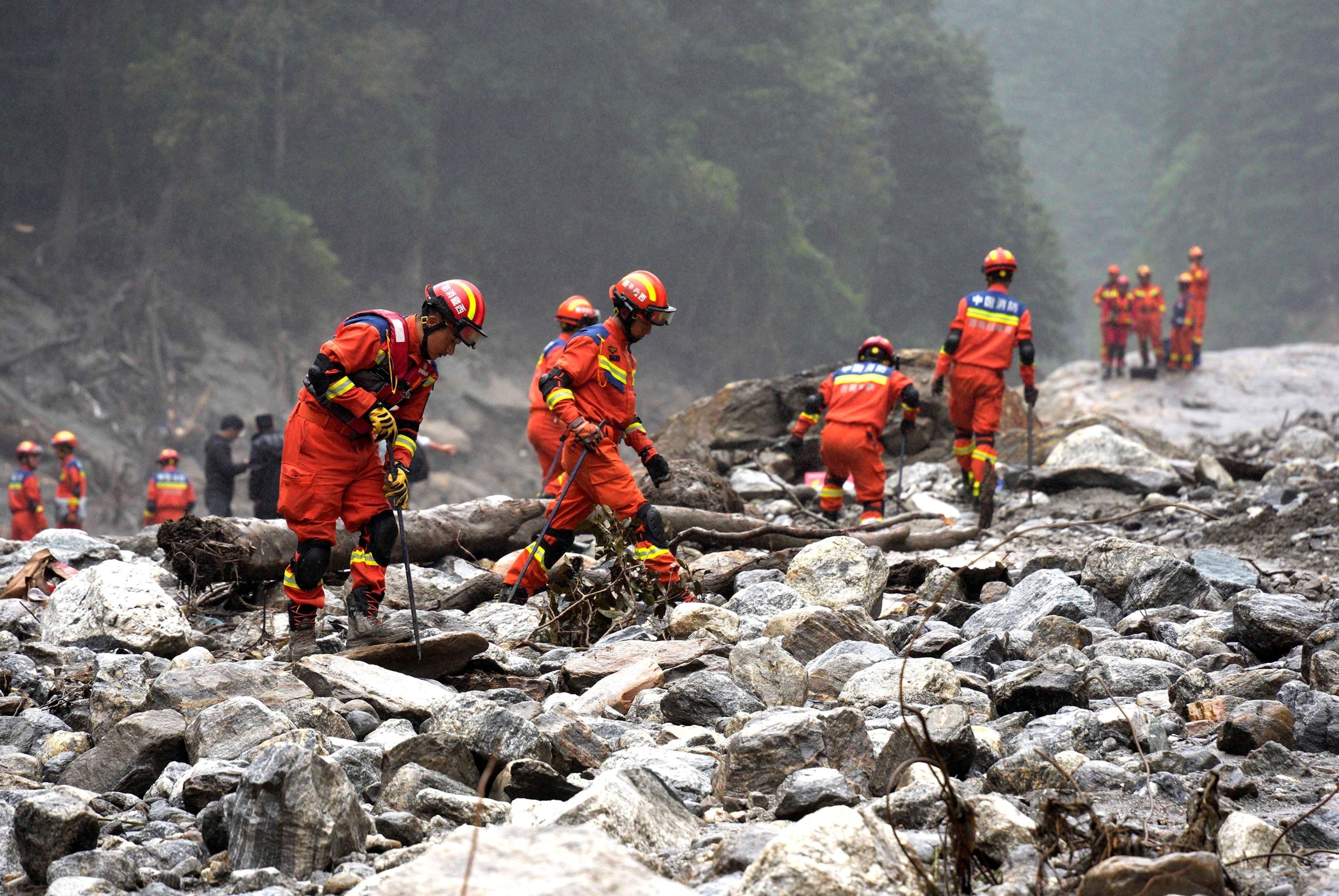 Firefighters conduct search and rescue operations along a river, after a mudslide in Gyirong county, Shigatse, Tibet Autonomous Region, China, Aug. 29, 2026.CNS Photo via Reuters