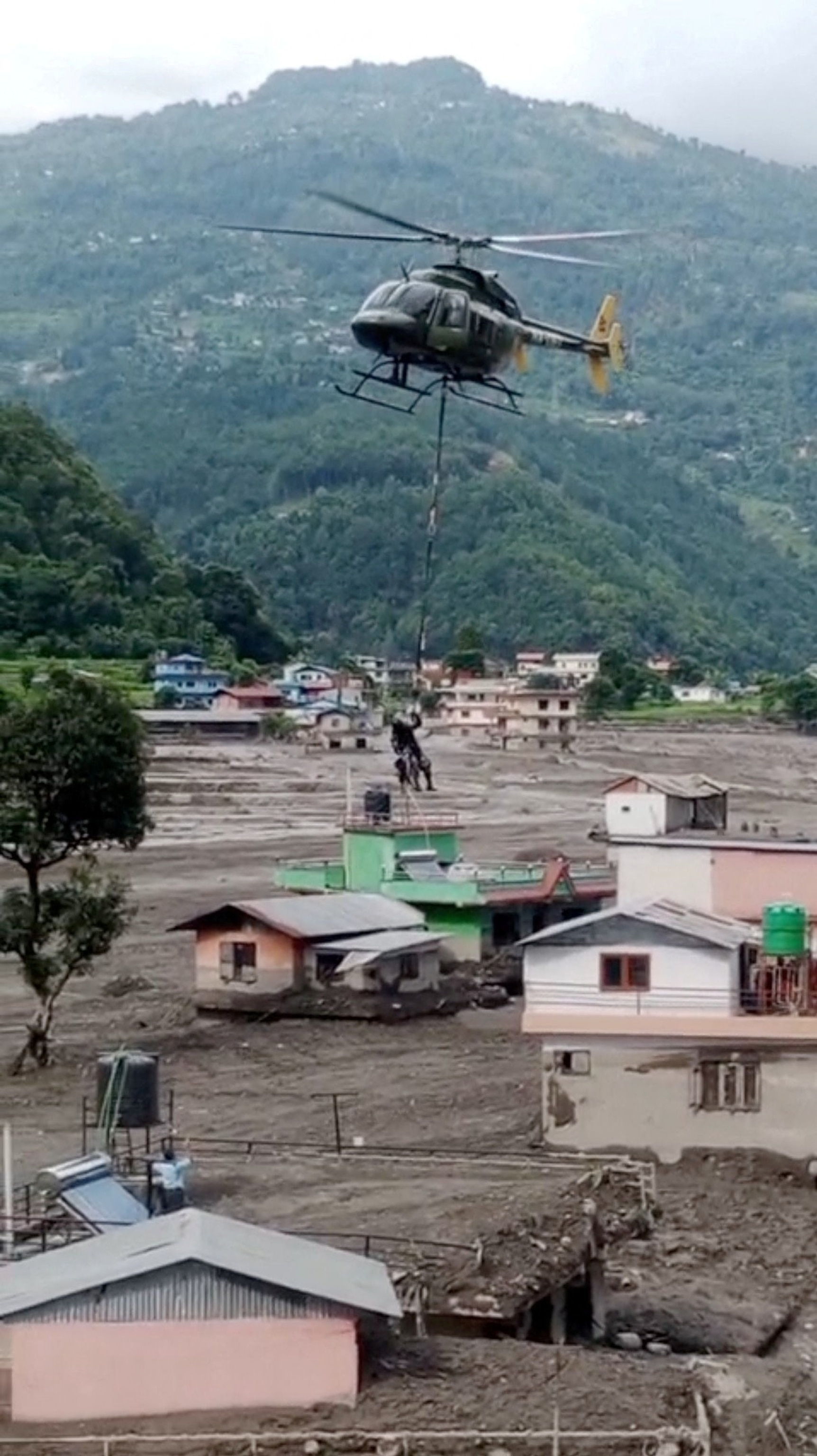 People rescued and airlifted from flood-affected areas arrive at Maithali Barrack, an army training centre that serves as a primary base for airlifting survivors, following flash floods and a mudslide in Trishuli, Nuwakot district, Nepal, Aug. 29, 2026.Navesh Chitrakar/Reuters