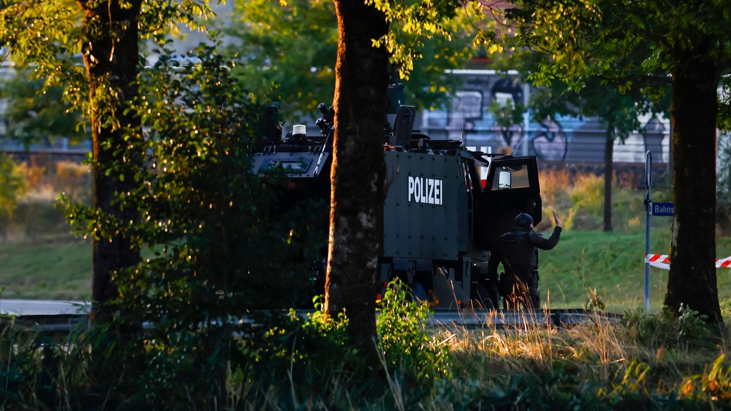 Image caption,An armoured vehicle was pictured in the area