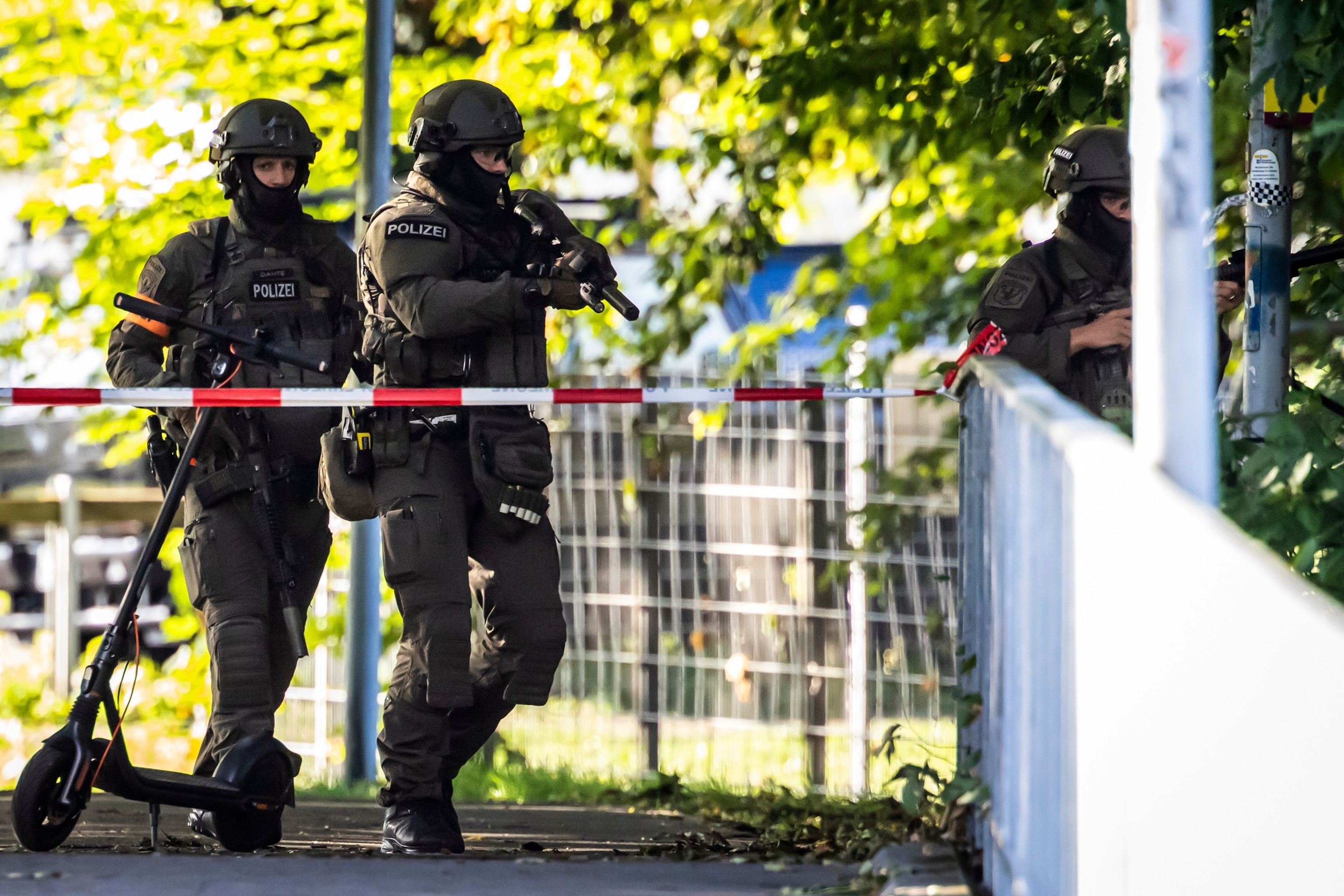 Armed police officers patrol in Aarau following a shooting during a rave event near Aarau, Switzerland, Sunday, Aug. 30, 2026.Michael Buholzer/Keystone via AP