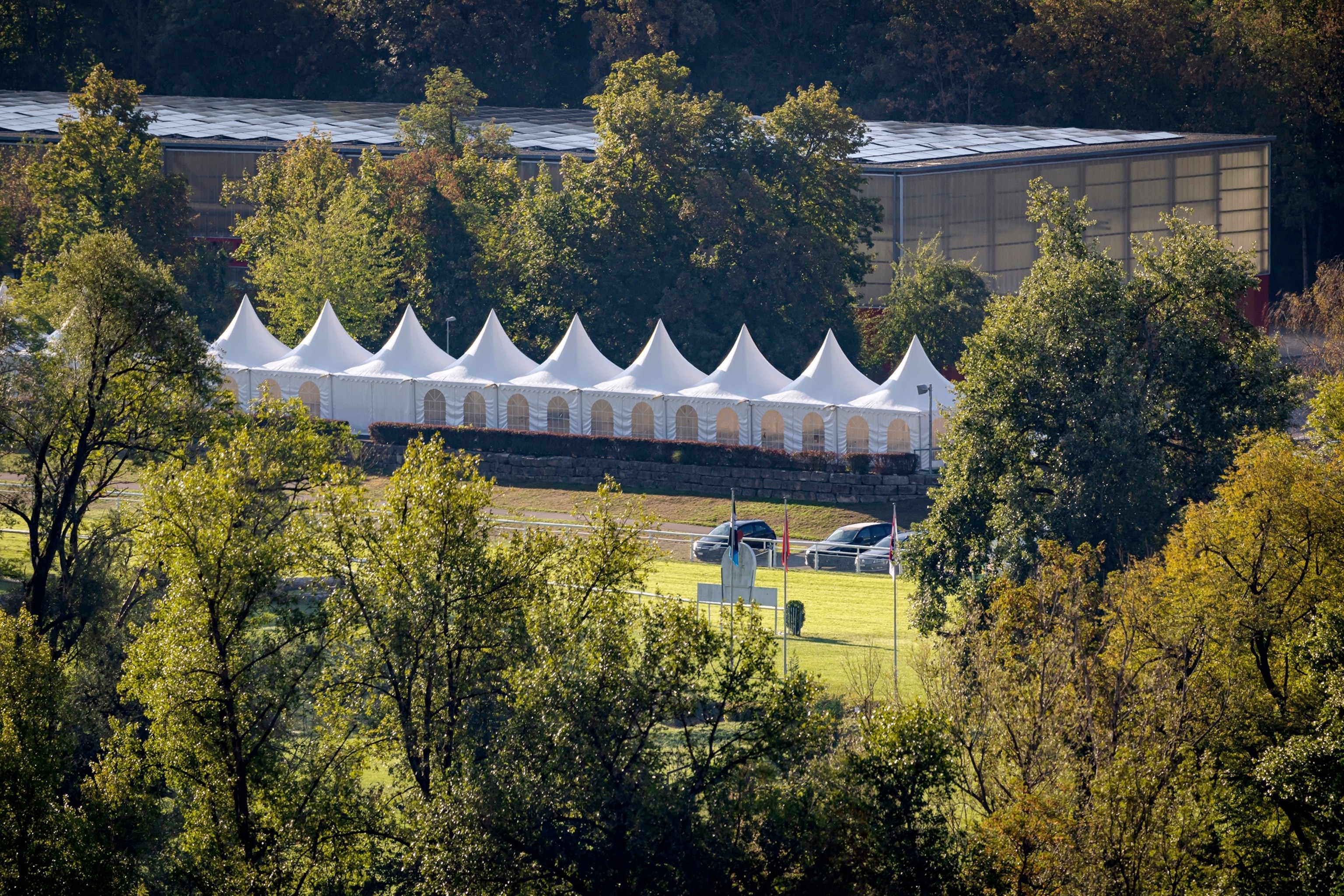 A general view shows the area of Schachen horse racing track, where a shooting occurred earlier during a rave event, in Aarau, Switzerland, Sunday, Aug. 30, 2026.Michael Buholzer/Keystone via AP