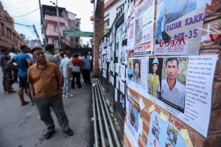 Relatives of people missing after flash floods in Rasuwa and Nuwakot search for information at Tribhuvan University Teaching Hospital on Aug. 30.Sanjit Pariyar / NurPhoto via Getty Images