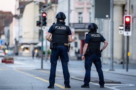Police officers patrol a street in Aarau on Sunday.Photograph: Michael Buholzer/EPA