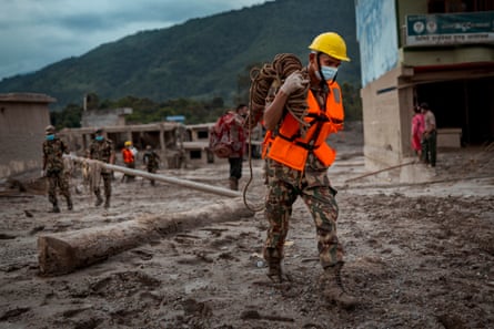 Soldiers search for bodies as rescue operations shift into search and retrieval in Nepal.Photograph: Ezra Acayan/Getty Images