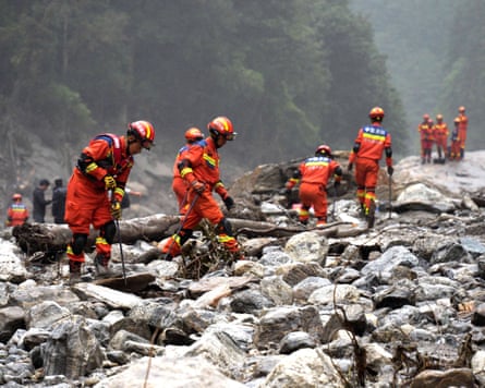 Firefighters conduct search and rescue operations along a river in Gyirong county in Tibet.Photograph: cnsphoto/Reuters