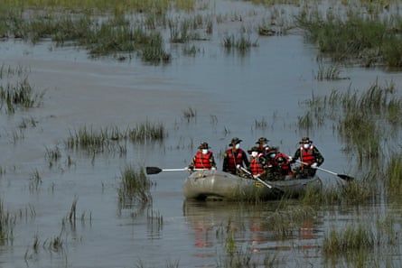 Army personnel conduct a search and rescue operation for flood victims along the Narayani River in Nepal’s Chitwan district on Sunday.Photograph: Prakash Mathema/AFP/Getty Images