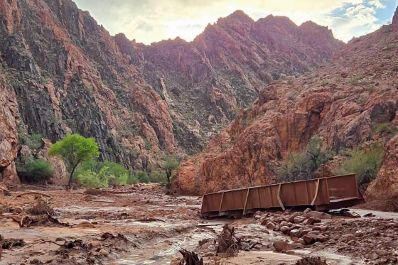 Remnants of stone bridge pylons remain along Bright Angel Creek following a flash flood that destroyed the footbridge Saturday.Grand Canyon National Park