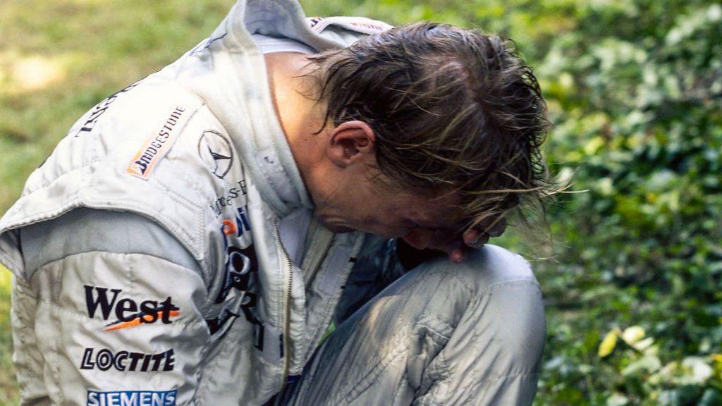 Image caption,McLaren's Mika Hakkinen is in tears after spinning off while in the lead in 1999, fearing it might be a decisive blow to his title hopes. However, the Finn would eventually beat Ferrari's Eddie Irvine to the drivers' championship.