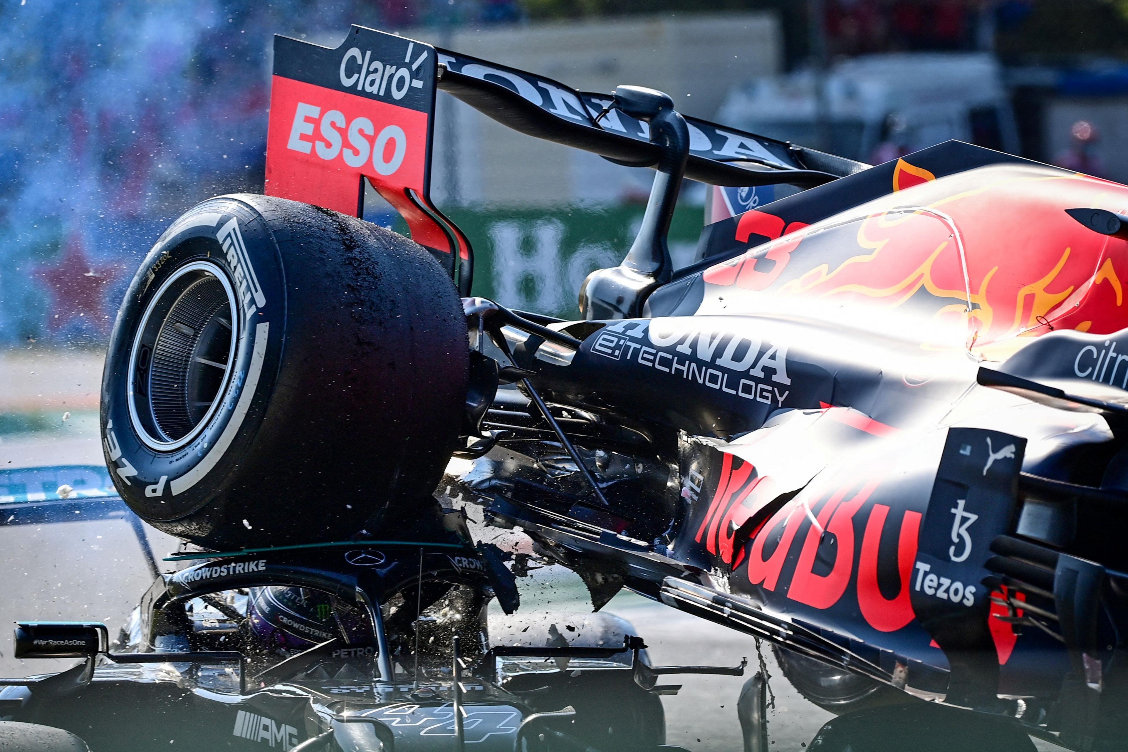 Image caption,The tumultuous 2021 season had many flashpoints between title contenders Max Verstappen and Lewis Hamilton. Monza was one of them with the two drivers coming together at the first chicane as they battled for position. The rear of Verstappen's Red Bull landed on Hamilton's Mercedes, and the importance of the halo head protection device can be seen here. It possibly saved the Briton from serious injury.