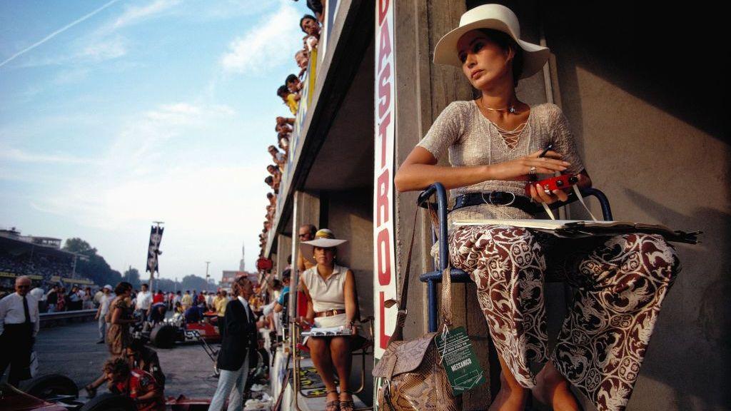 Image caption,Nina Rindt sits in the pits, timekeeping for her husband Jochen during a practice session in 1970. Shortly after this picture was taken, the Austrian driver was killed on the approach to the Parabolica corner, almost certainly because of a suspension failure on his Lotus. A few weeks later, Rindt became F1's only posthumous world champion.