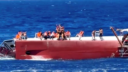 A helicopter searching for survivors during the rescue operation off the coast of Kyrenia.Photograph: Jewel Samad/AFP/Getty Images
