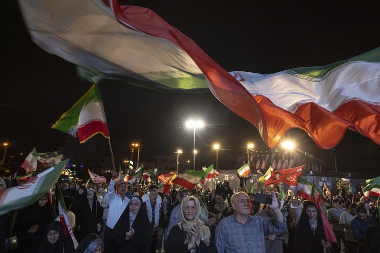 Pro-government supporters during a rally in Tehran on Sunday.Morteza Nikoubazl / NurPhoto via Getty Images