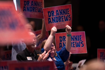 People hold signs for Dr Annie Andrews during the Spratt Issues conference at the Francis Marion University Performing Arts Center on 22 August.Photograph: Sean Rayford/Getty Images