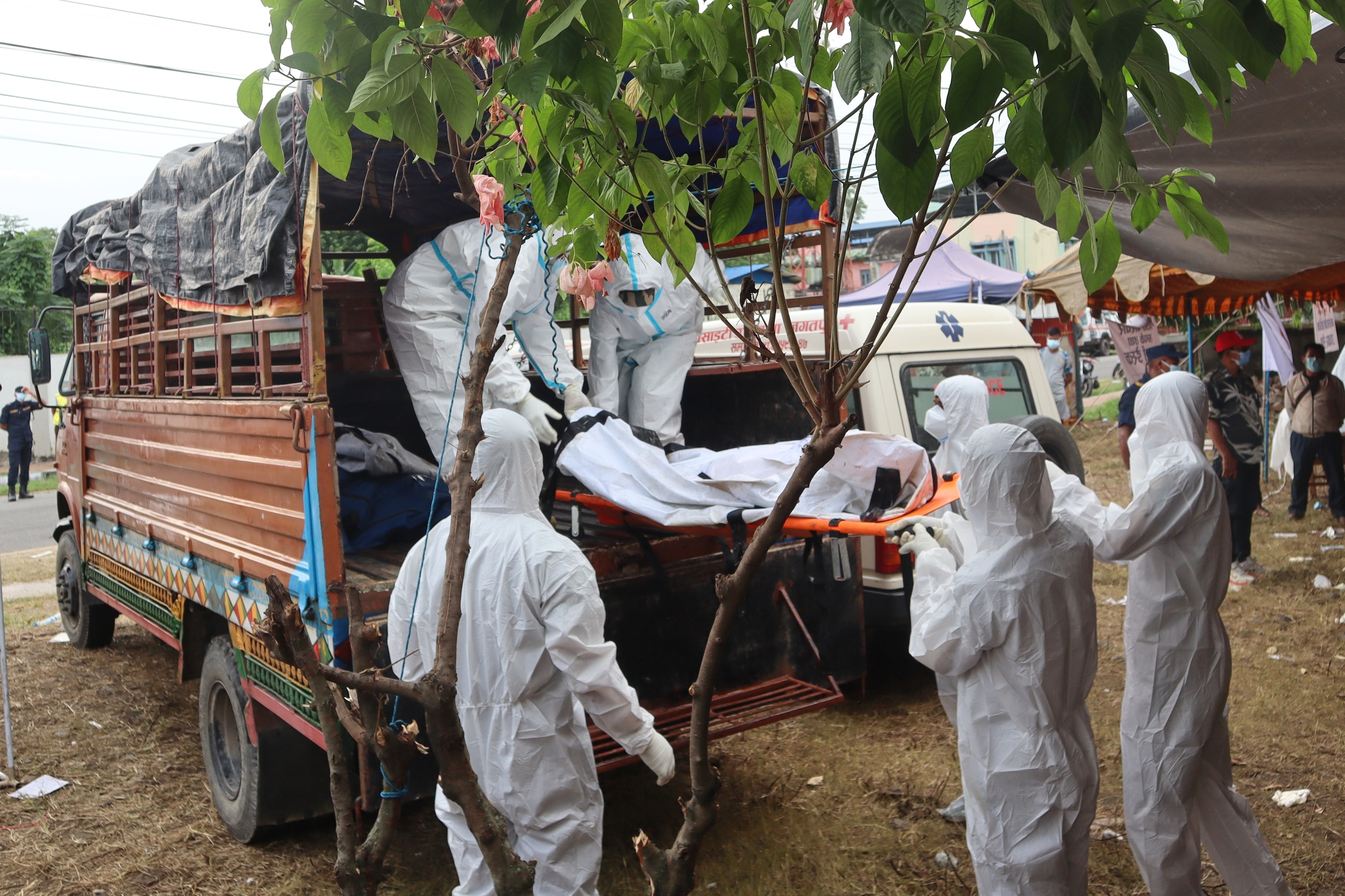Rescuers carry bodies of flash flood victims for a mass burial in Chitwan, Nepal, Saturday, Aug. 29, 2026. (AP Photo/Nisha Shrestha)The Associated Press