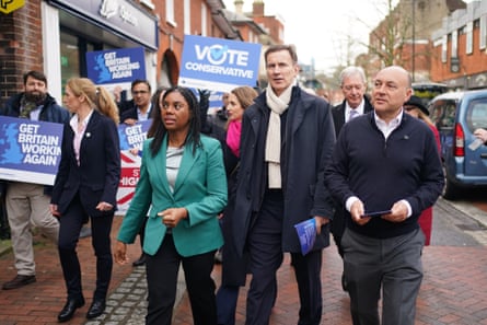 Andrew Griffith, right, with Kemi Badenoch and former chancellor Jeremy Hunt, second from right, during a visit to Godalming, Surrey earlier this year.Photograph: Ben Whitley/PA