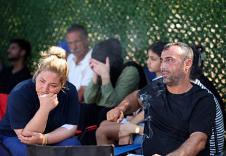Ayten and Hayri Biçer wait for news of their two missing children outside the port of Kyrenia.Photograph: Yiannis Kourtoglou/Reuters