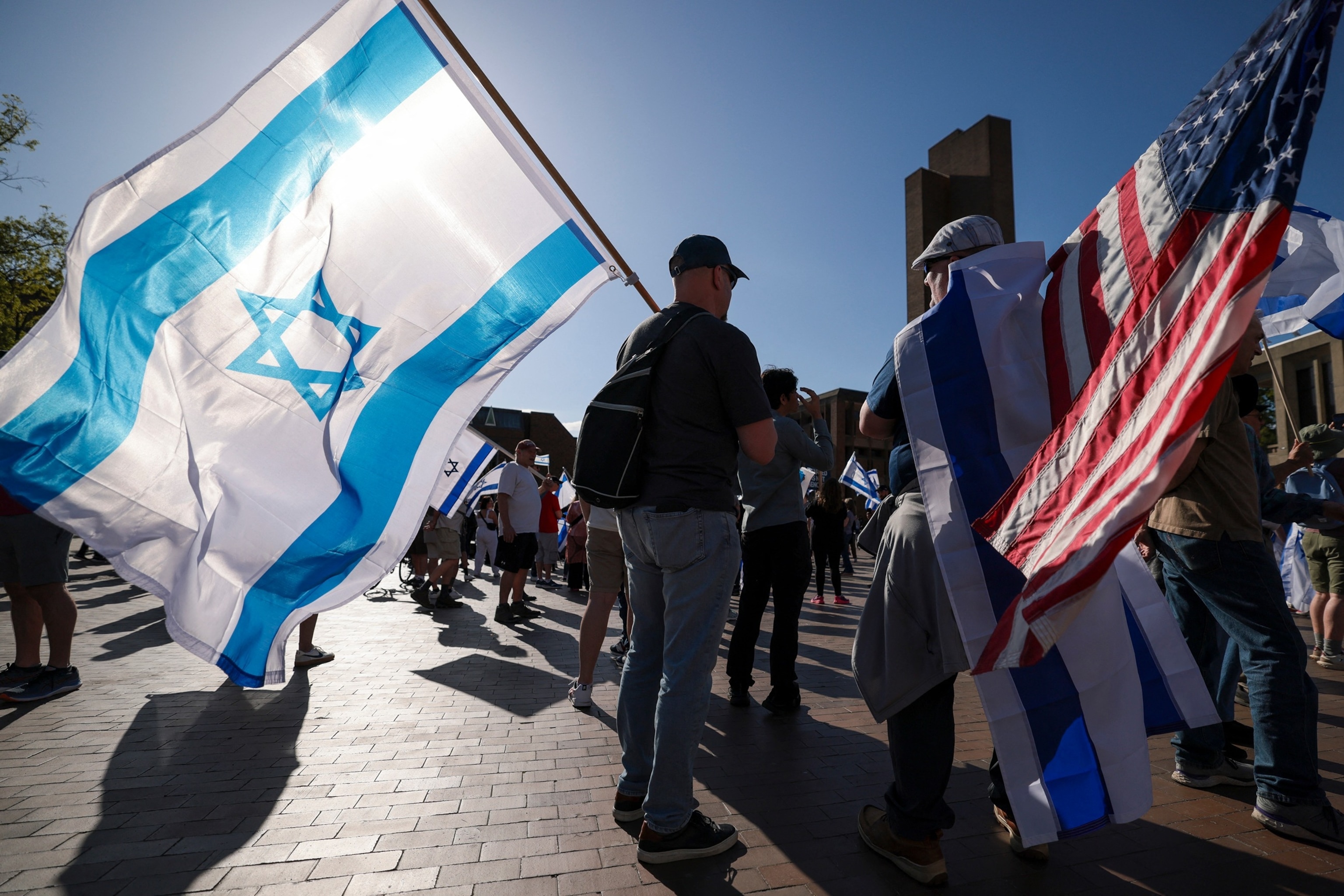 In this May 12, 2024, file photo, people carry Israeli and American flags during a "United for Israel" march in Seattle.Jason Redmond/AFP via Getty Images