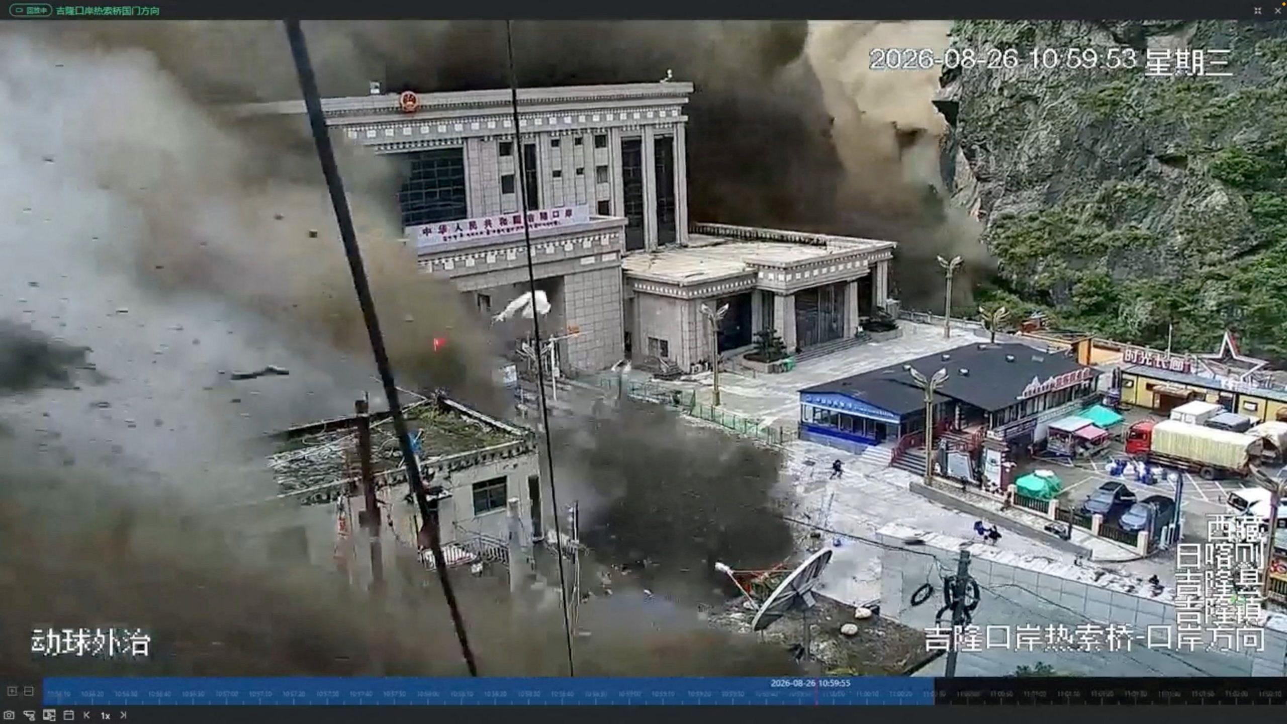 Image caption,CCTV footage shows people fleeing as mud and water engulf buildings at the Nepal-China border in Gyirong on 26 August