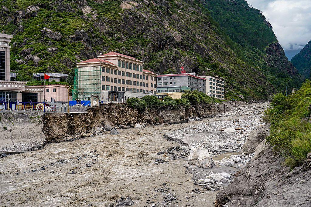 Image caption,Flooding in Rasuwagadhi destroyed the Friendship Bridge, roads and a hydropower substation, and swept away vehicles in Rasuwa, Nepal, last July