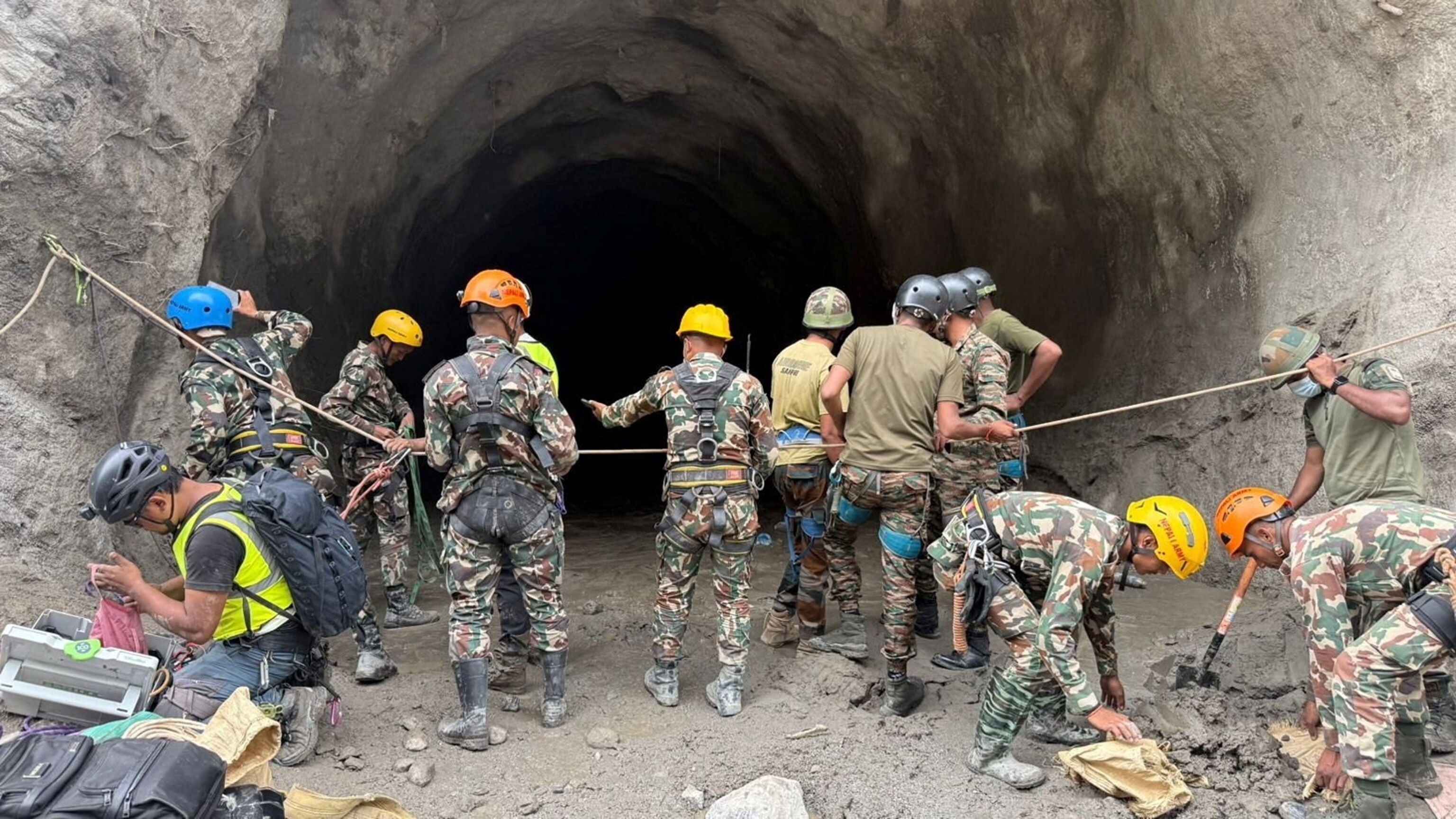 Nepal army soldiers work during a search and rescue operation outside a tunnel near the Hydropower Project sites, following deadly flash floods and mudslides, in Rasuwa district, Nepal, in this handout obtained by Reuters on September 1, 2026.Nepal Army via Reuters
