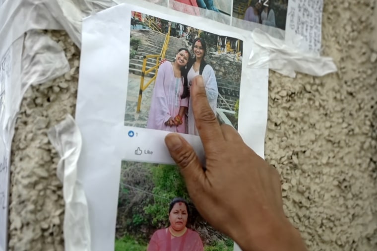 A poster featuring Kalpona Shrestha’s missing family members.Adam Galica / NBC News