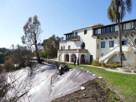 People survey the fire damage to the Villa Aurora in Pacific Palisades in January last year.Photograph: Dpa Picture Alliance/Alamy