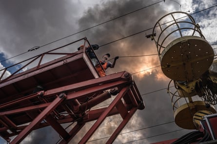 Railway workers repairing overhead lines after a Russian strike.Photograph: Jelle Krings