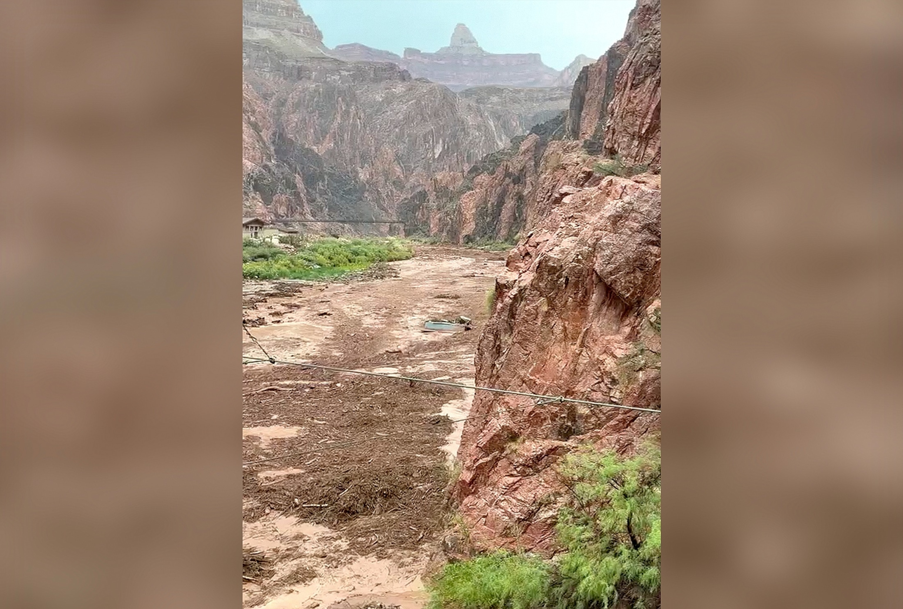Debris, including structures, are seen being swept away in a creek at the Grand Canyon, August 29, 2026.Erica Viola