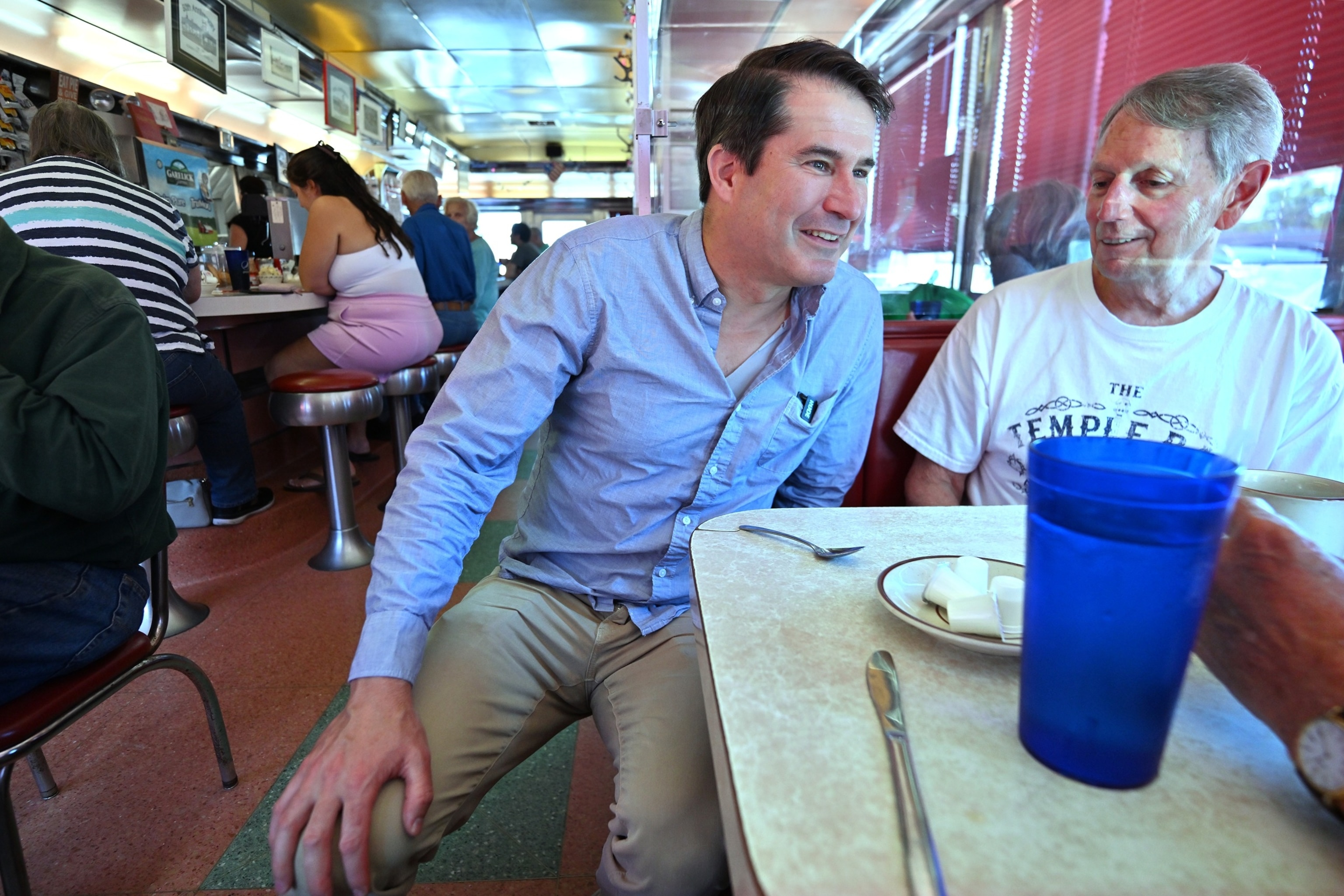 Rep. Seth Moulton, who is challenging Sen. Ed Markey, D-Mass. in the Sept. 1, 2026 primary, speaks to Rich Giannino of Essex, Mass., during a campaign stop at the Agawam Diner, Aug. 29, 2026, in Rowley, Mass.Josh Reynolds/AP Photo