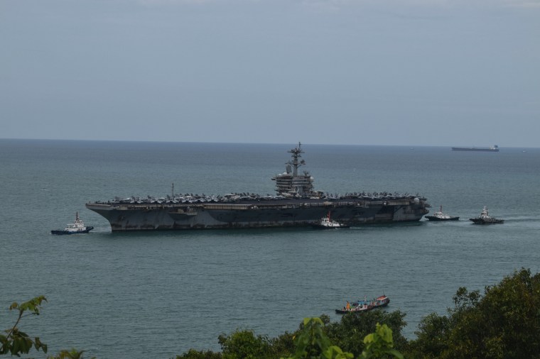 A crew member on the Lincoln flight deck on Wednesday.Anthony Wallace / AFP via Getty Images