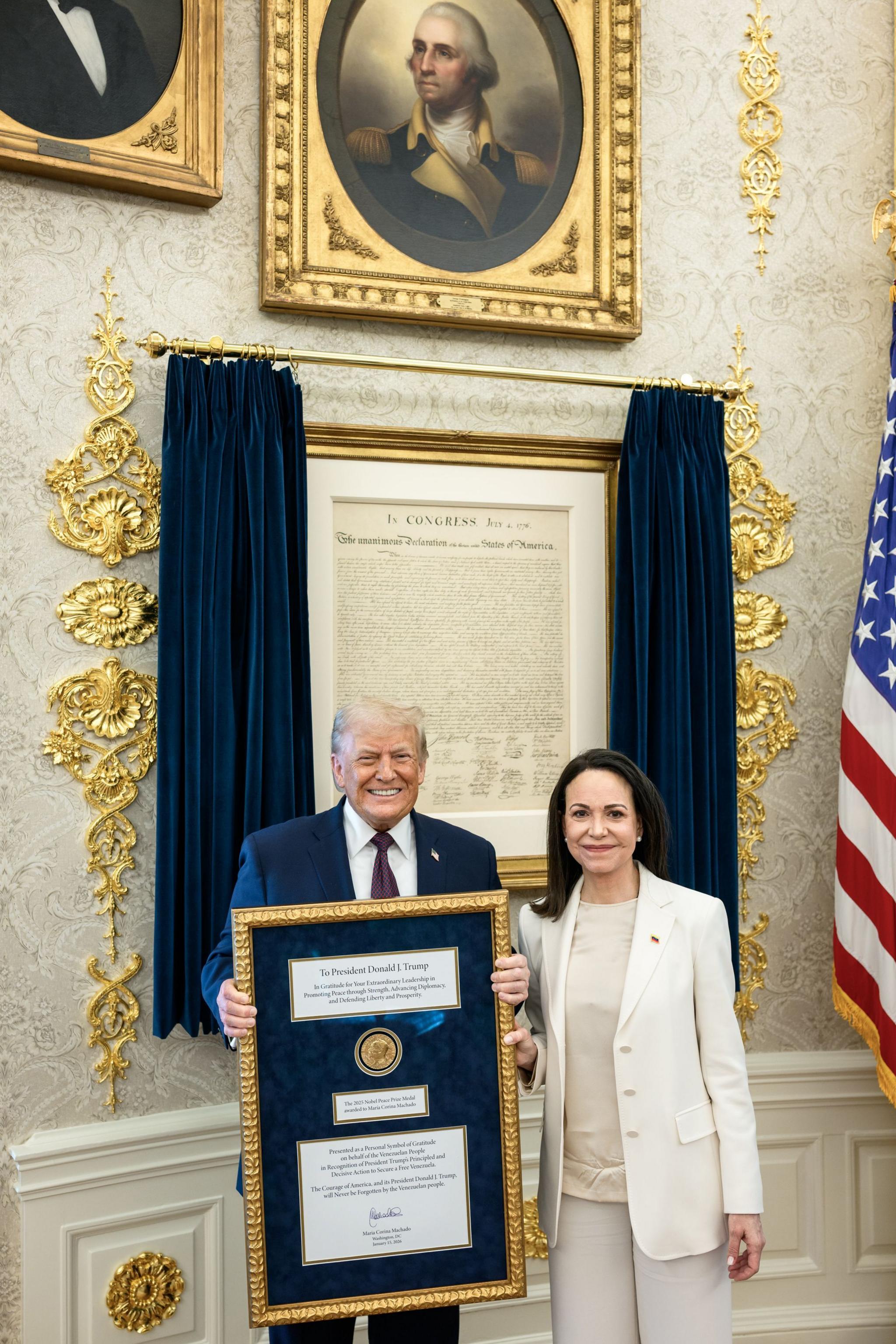 Image caption,María Corina Machado presented President Trump with her Nobel Peace Prize