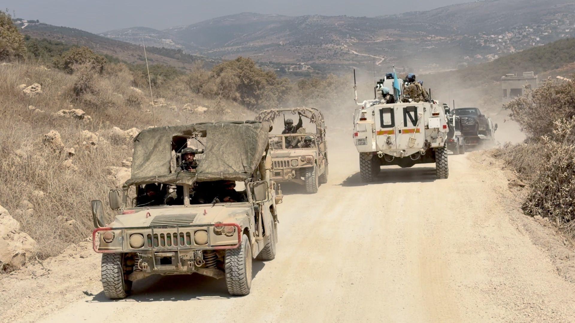Image caption,Israeli soldiers drive on a road along the wall separating Lebanon and Israel