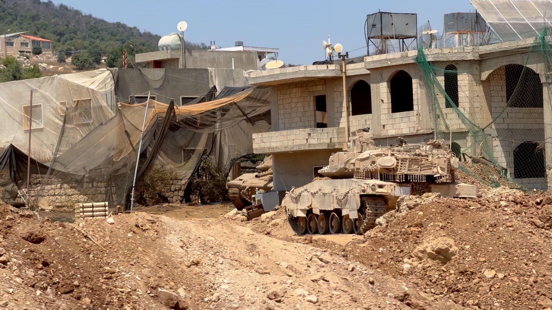 Image caption,Some of the houses used by the Israeli military are covered in netting to protect them from Hezbollah's explosive drones