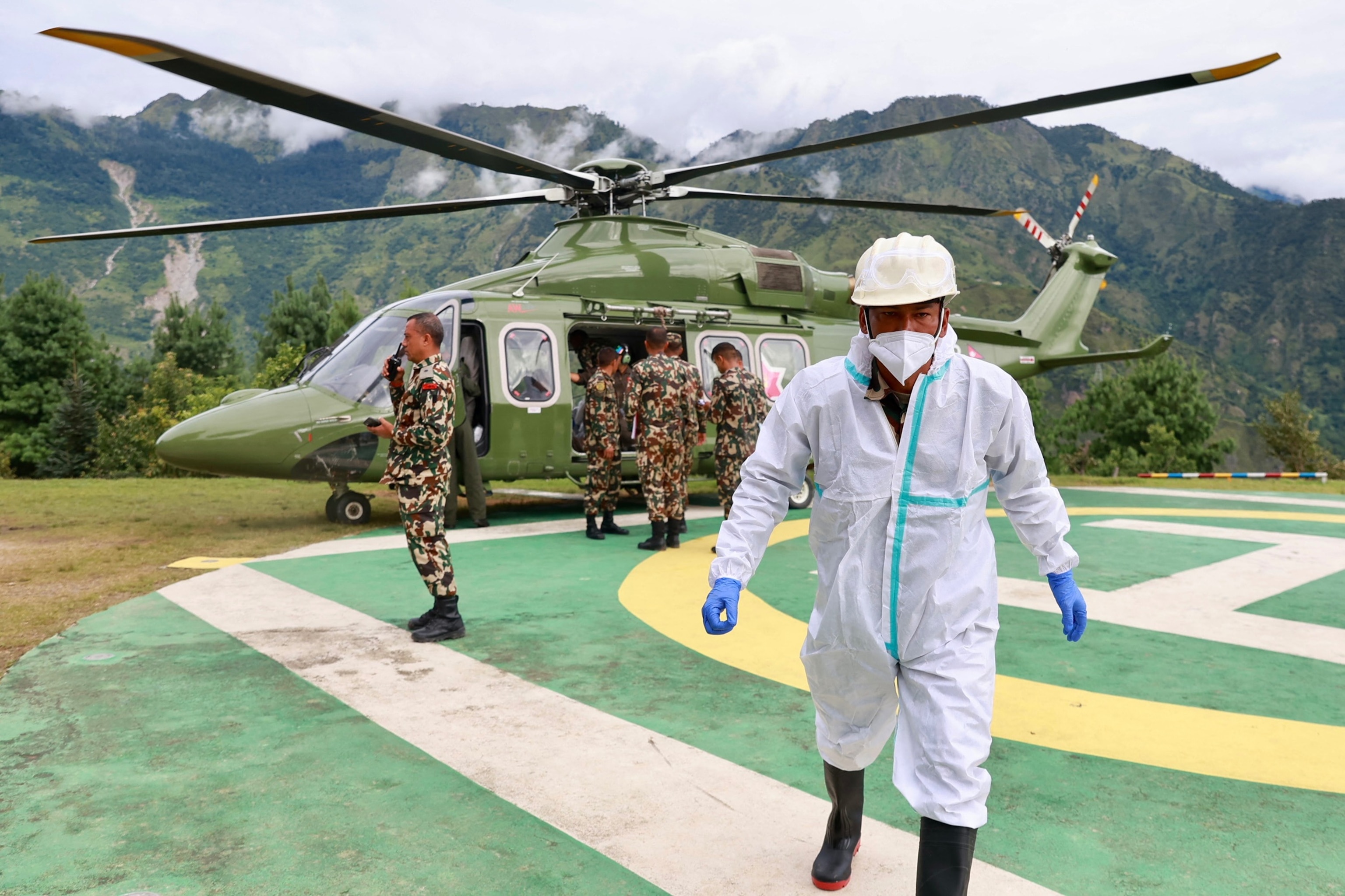 A Nepal Army helicopter carries dead bodies from the flood affected area in Nepal's Rasuwa district on September 2, 2026.Prabin Ranabhat/AFP via Getty Images