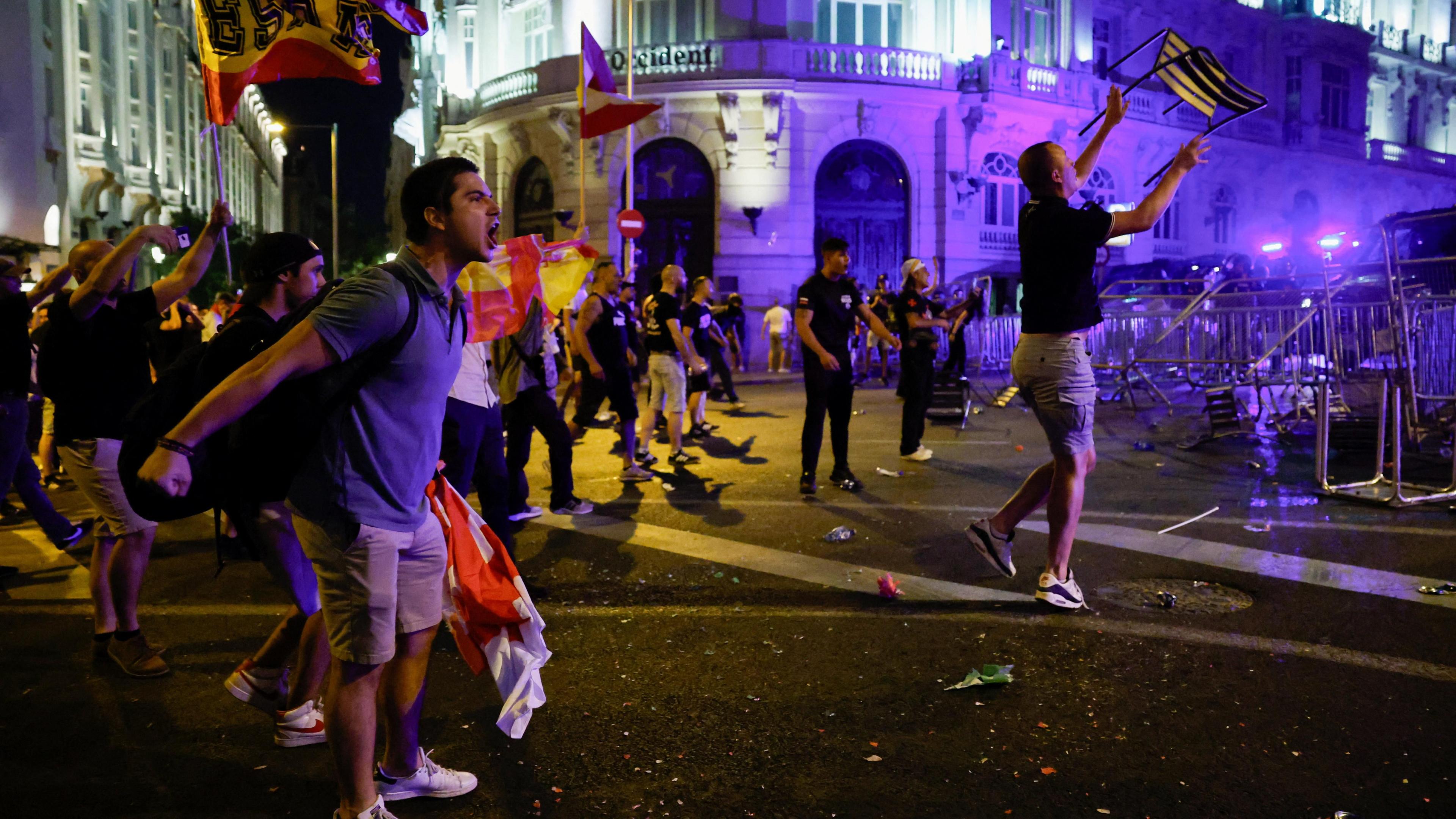 Image caption,Protesters face off with police in Madrid on Wednesday night