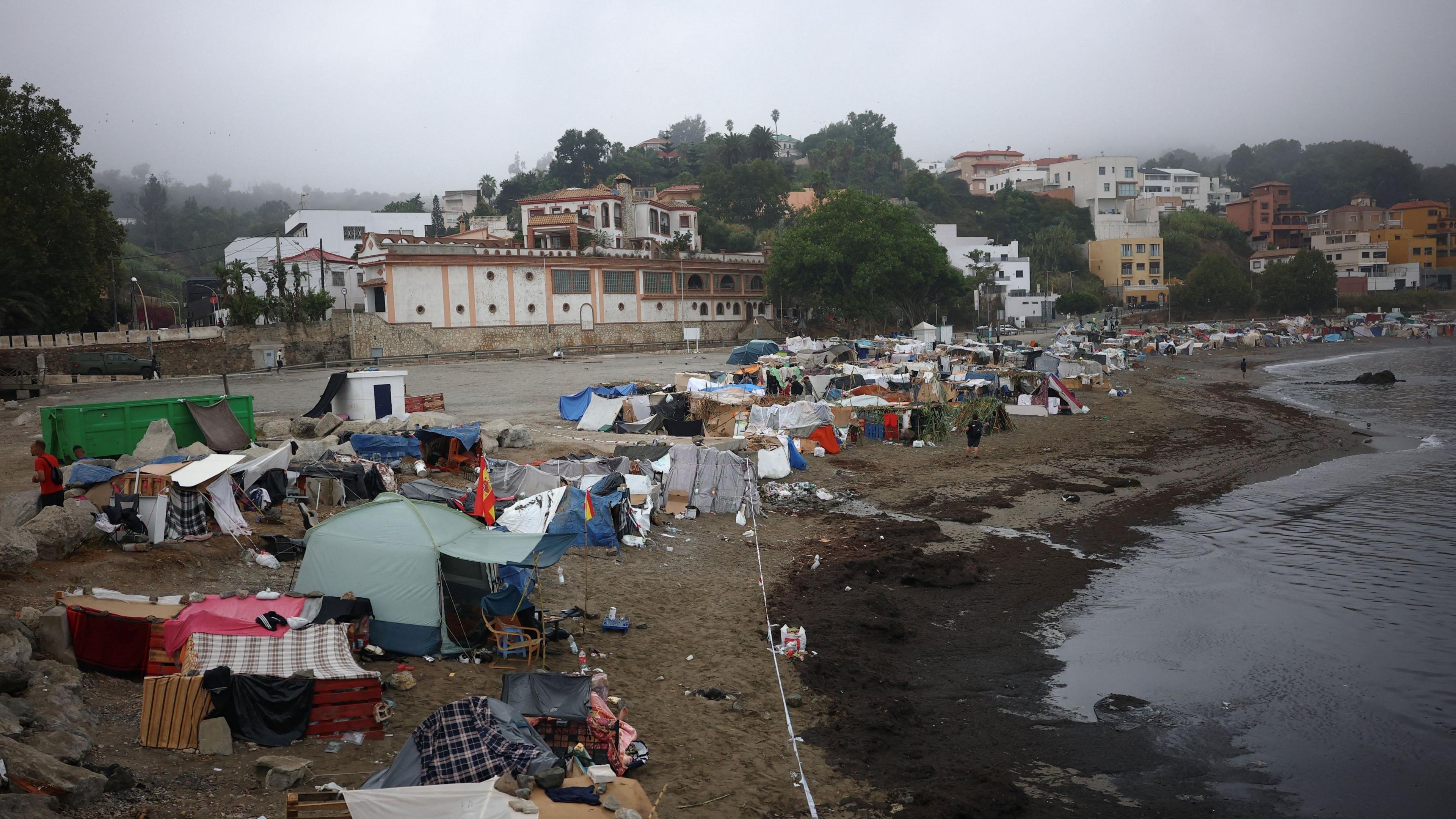 Image caption,Thousands of migrants are still in Ceuta weeks after more than 70,000 people crossed the border