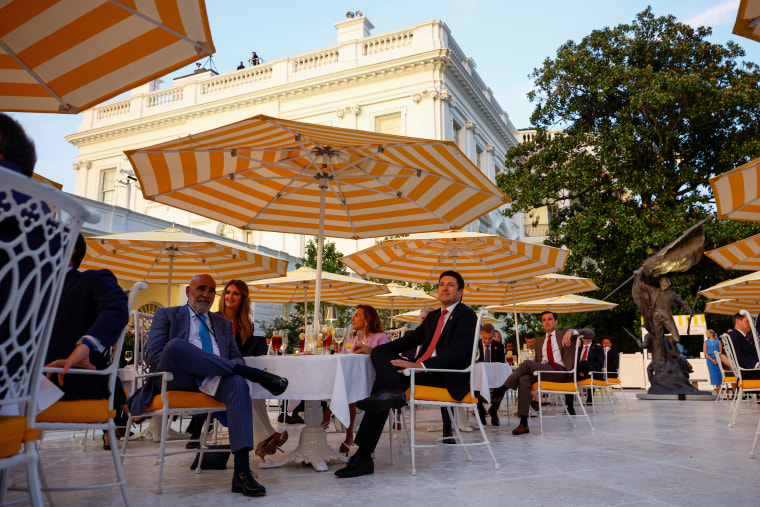 Guests listen as Trump hosts in the Rose Garden at the White House.Kevin Dietsch / Getty Images