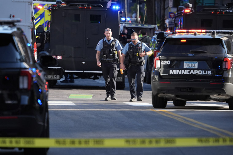A large police presence at the scene of a shooting in downtown Minneapolis on Wednesday.Ellen Schmidt / AP