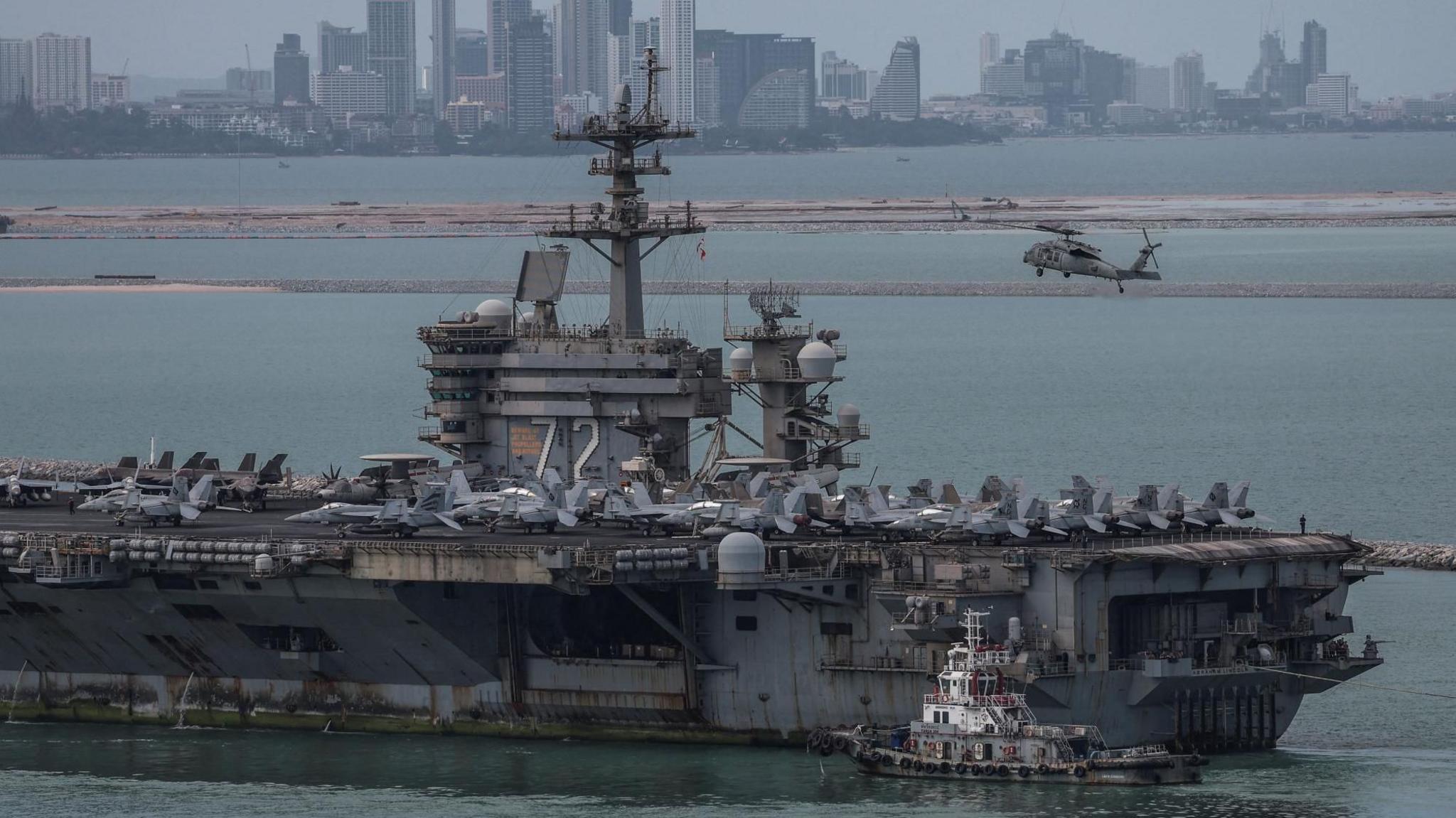 Image caption,The nuclear-powered aircraft carrier has spent nine months at sea