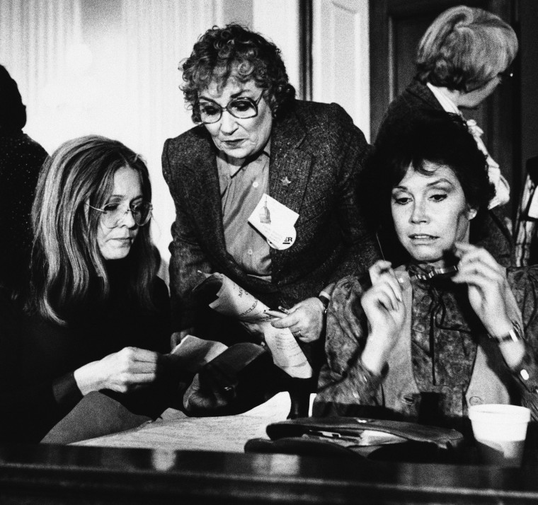 Steinem, left, joins former Congresswoman Bella Abzug and actress Mary Tyler Moore, right, during a meeting of women’s rights leaders on Capitol Hill in 1981.John Duricka / AP file