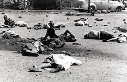 Dead and wounded South Africans lie outside the Sharpeville police station.Photograph: PN2