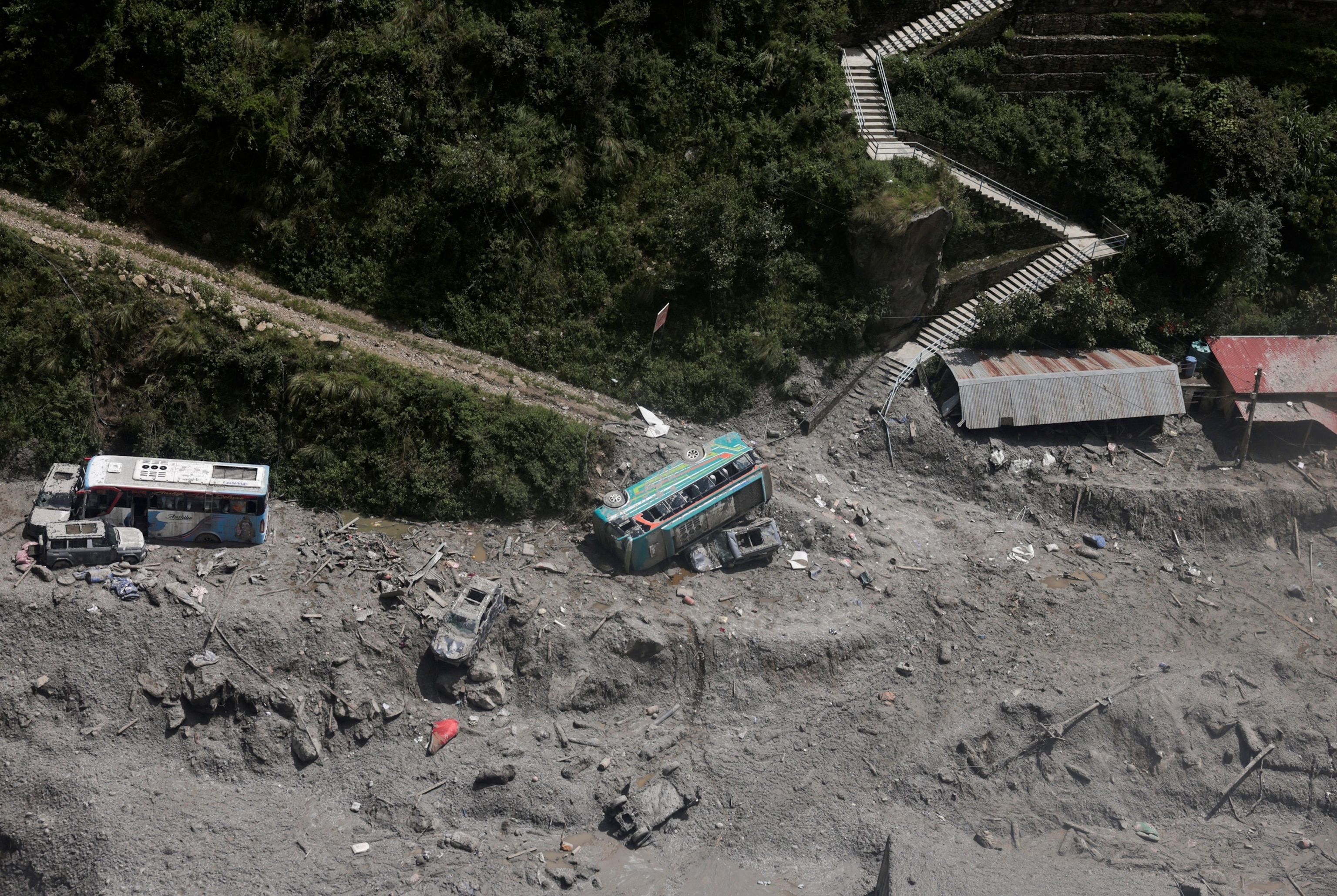 An aerial view shows vehicles lying amid debris at Timure Bazar following the deadly flash floods and mudslides in Rasuwa, Nepal, Sept. 3, 2026.Navesh Chitrakar/Reuters